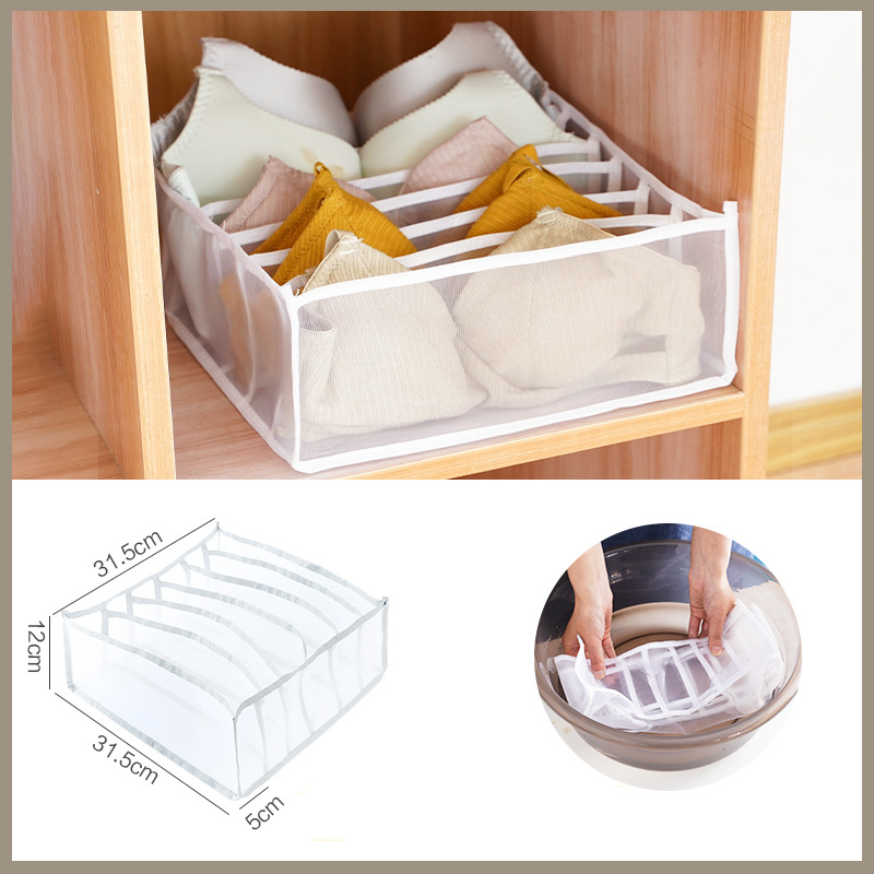 Fabric organizer with separate compartments sitting neatly in a dresser drawer