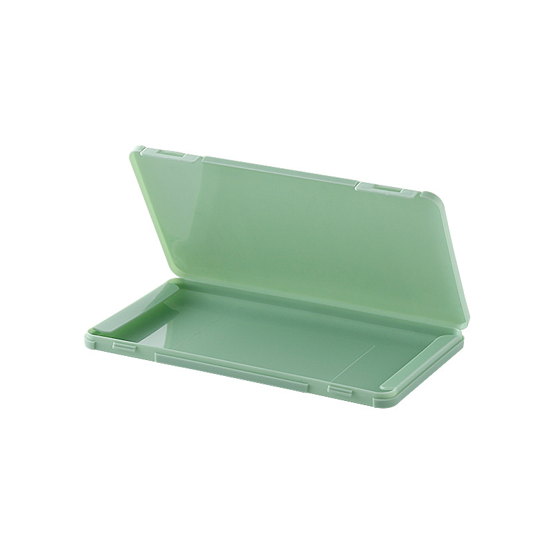Open sage green mask case showing the inner tray and hinge