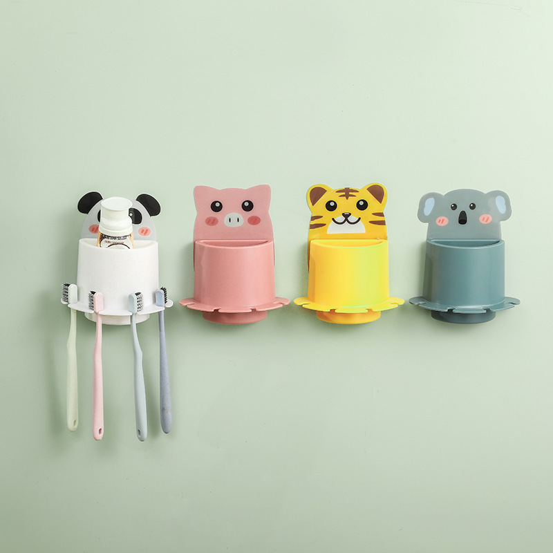 Panda, pig, tiger and koala wall cups lined up in a row on a wall