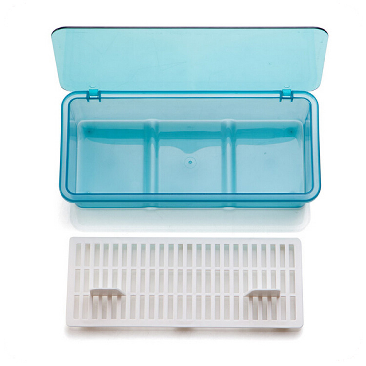 Empty sky blue storage box with lid open beside a loose white tray