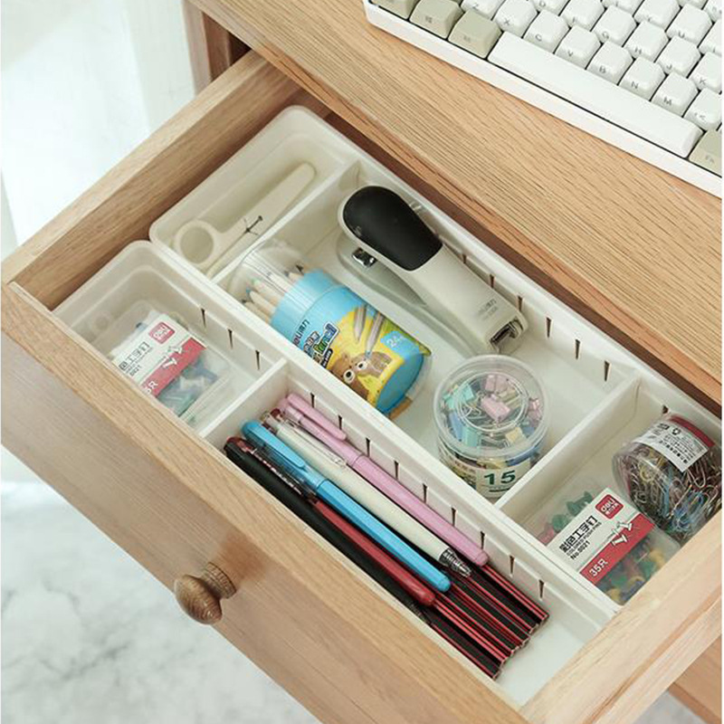Desk drawer with stationery mixed together before sorting