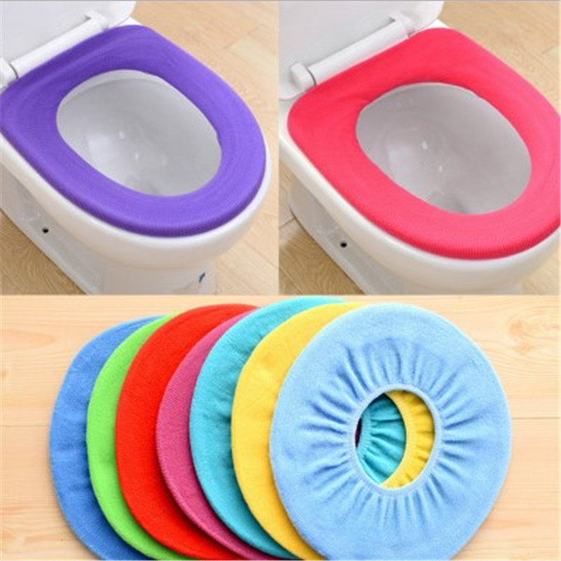 Knitted seat cover with ribbed edge set over a standard toilet seat