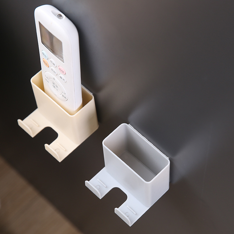 Angled close-up of a cream caddy showing its deep cup and rear hook tabs