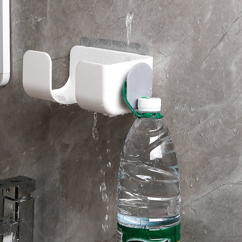 White wall bracket with grey side clip and cord detail, water droplets on the wall