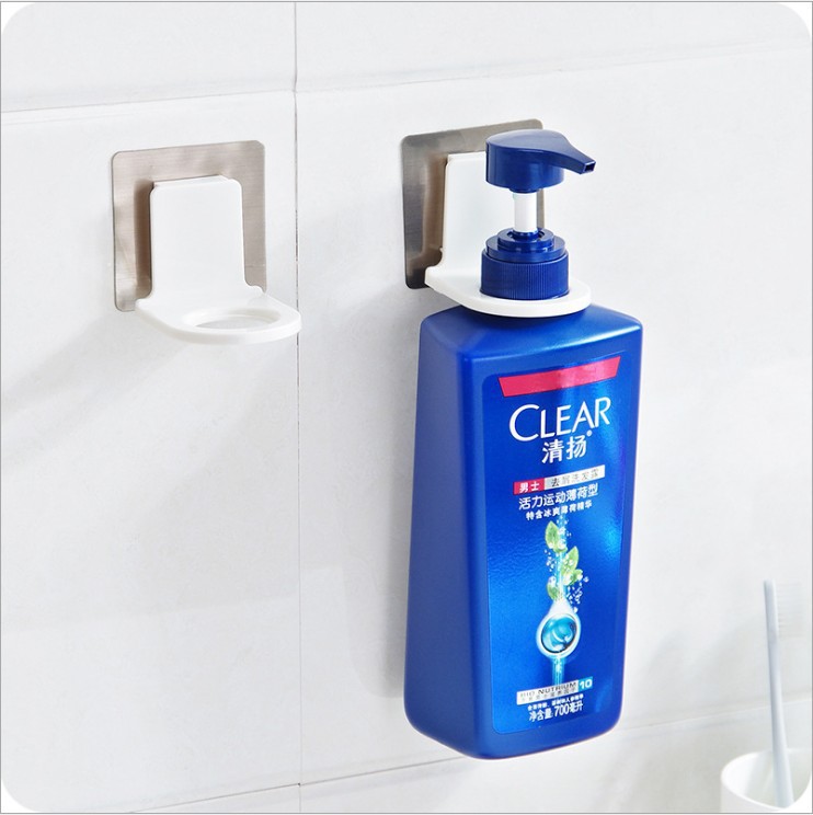 Blue shampoo bottle with pump seated upright in white rack on tile wall