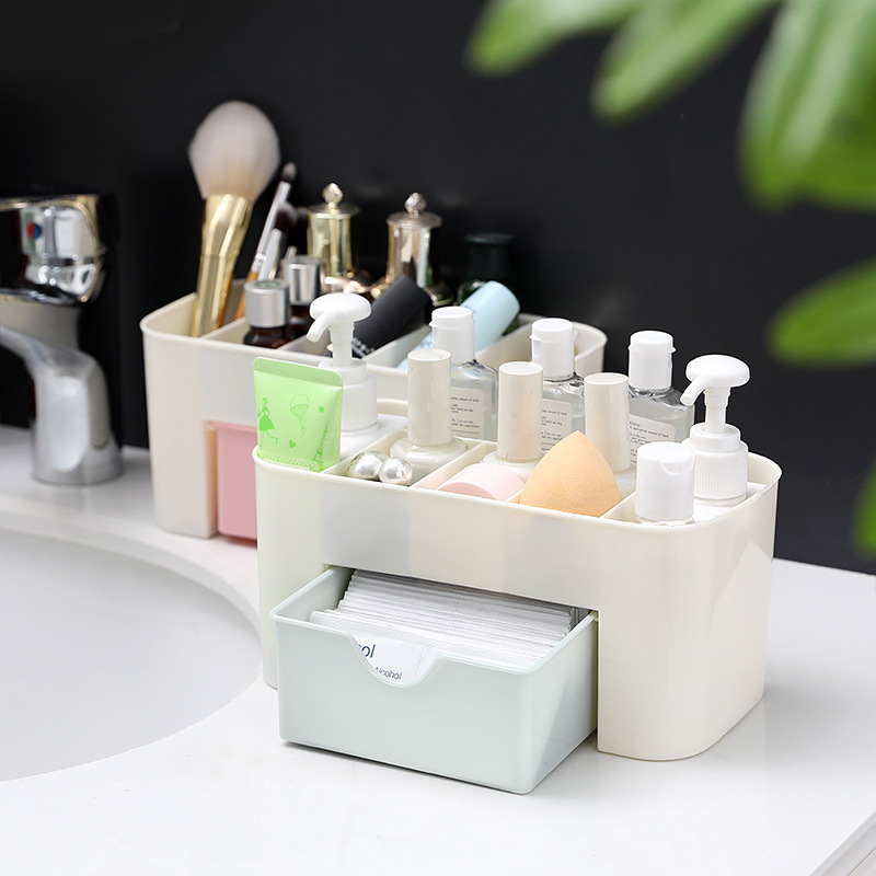 Mint drawer pulled out revealing cotton pads beside bottles and sponges