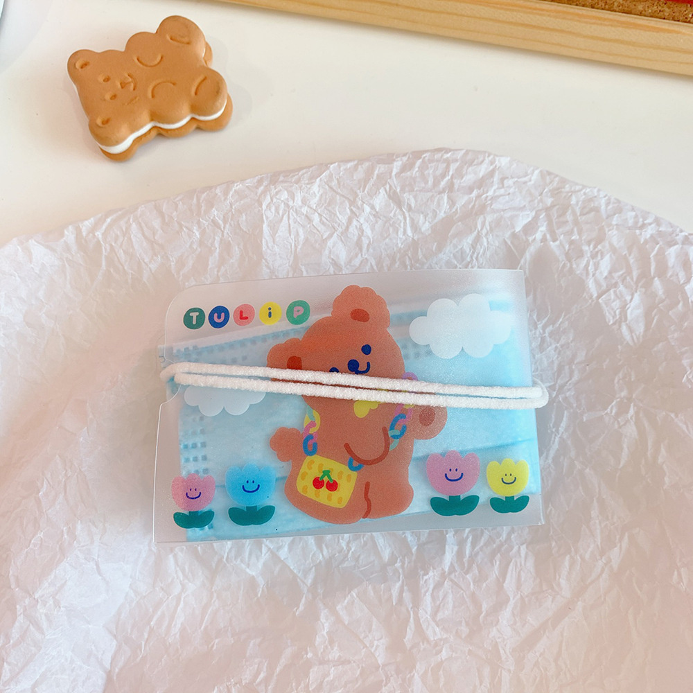 Cartoon bear mask pouch styled with pastel desk accessories