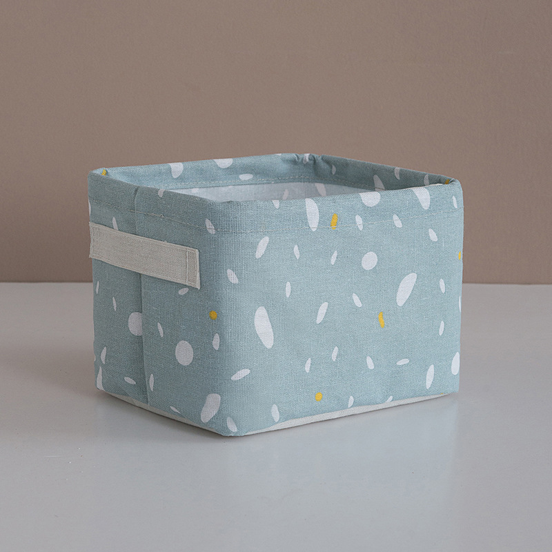 Grey cotton-linen basket holding small items in a tidy room
