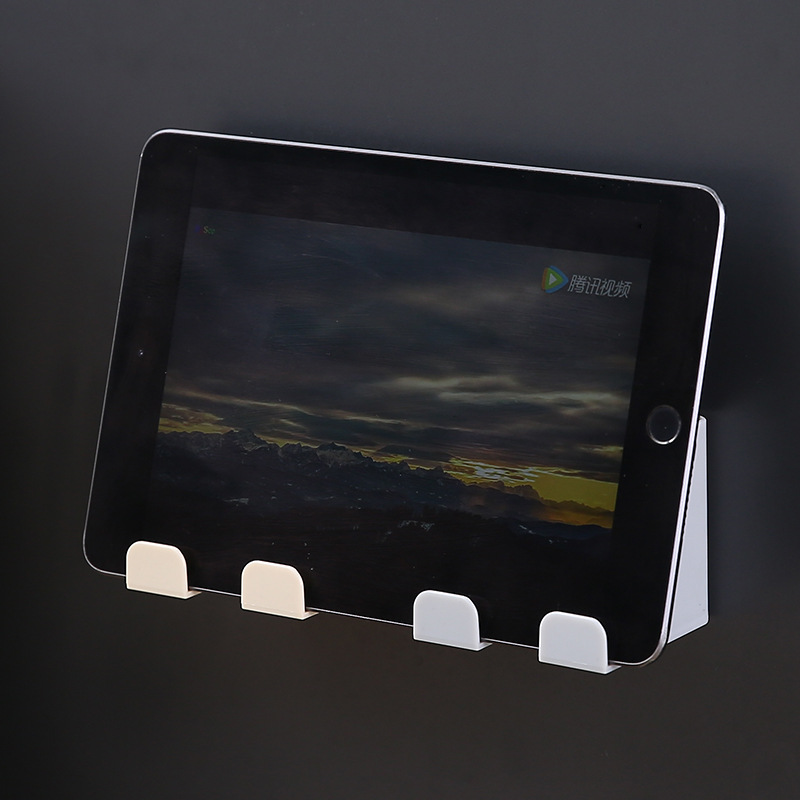 Tablet resting upright on the slotted ledge of a wall caddy