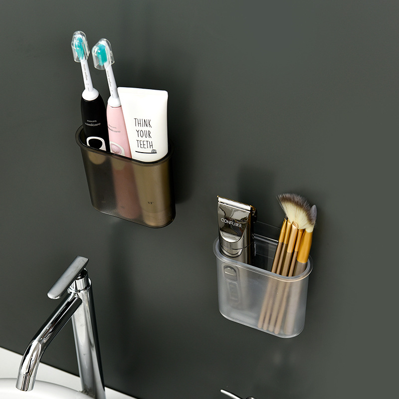 Smoky wall tub mounted above a basin holding brushes and paste