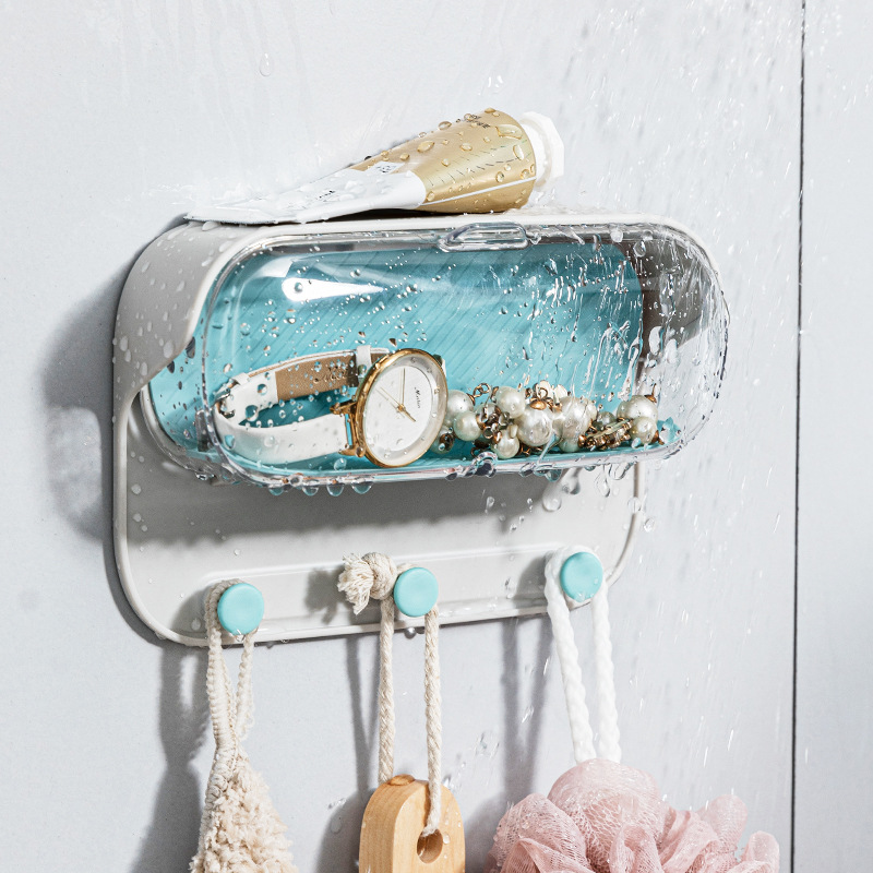 Water droplets bead on the clear lid while items stay dry underneath