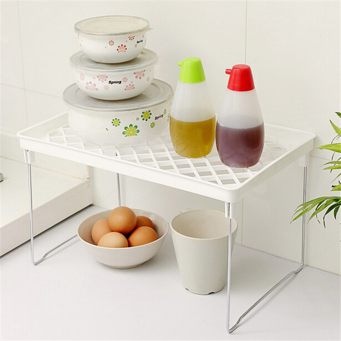 Open space under the top tier of a counter rack holding sealed containers