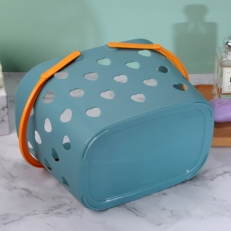 Close view of heart cutouts running around the teal tote walls