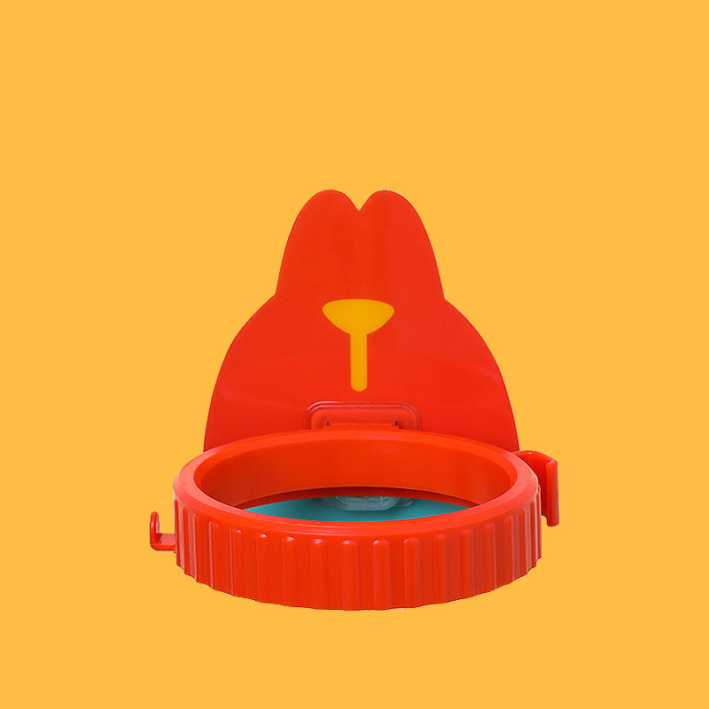 Close-up of the red holder showing its ribbed ring and cartoon backplate