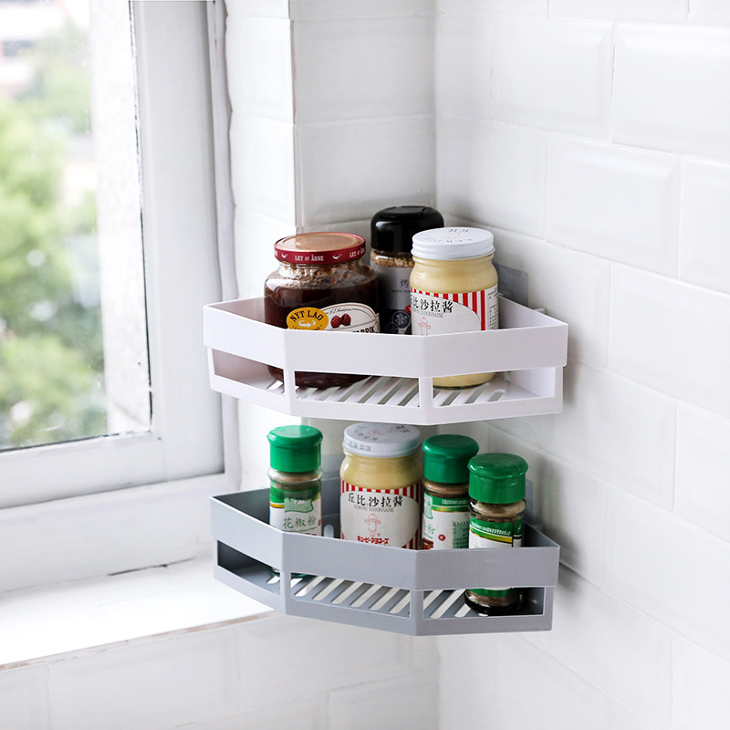 Corner wall rack beside a window holding jars and spice bottles