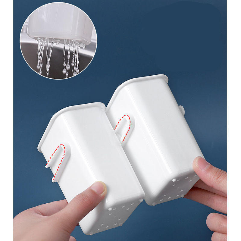 Two white cups held in hand showing the side hook tabs
