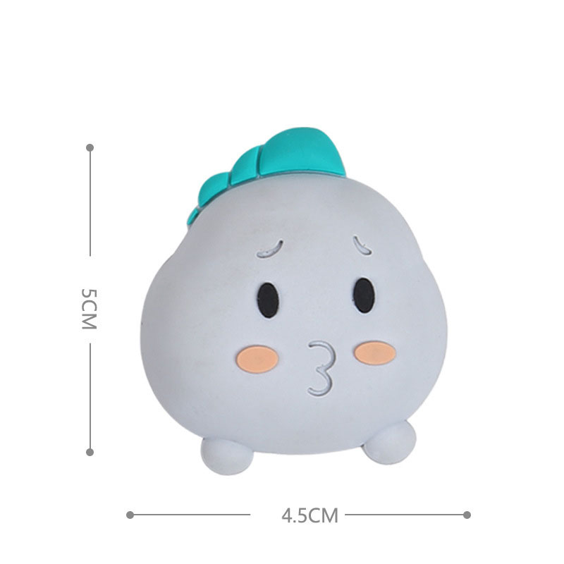 Grey elephant silicone door stopper with teal crest showing soft matte finish