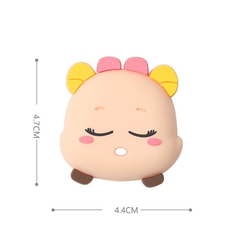 Cream bear-style silicone door stopper with yellow bow and closed eyes