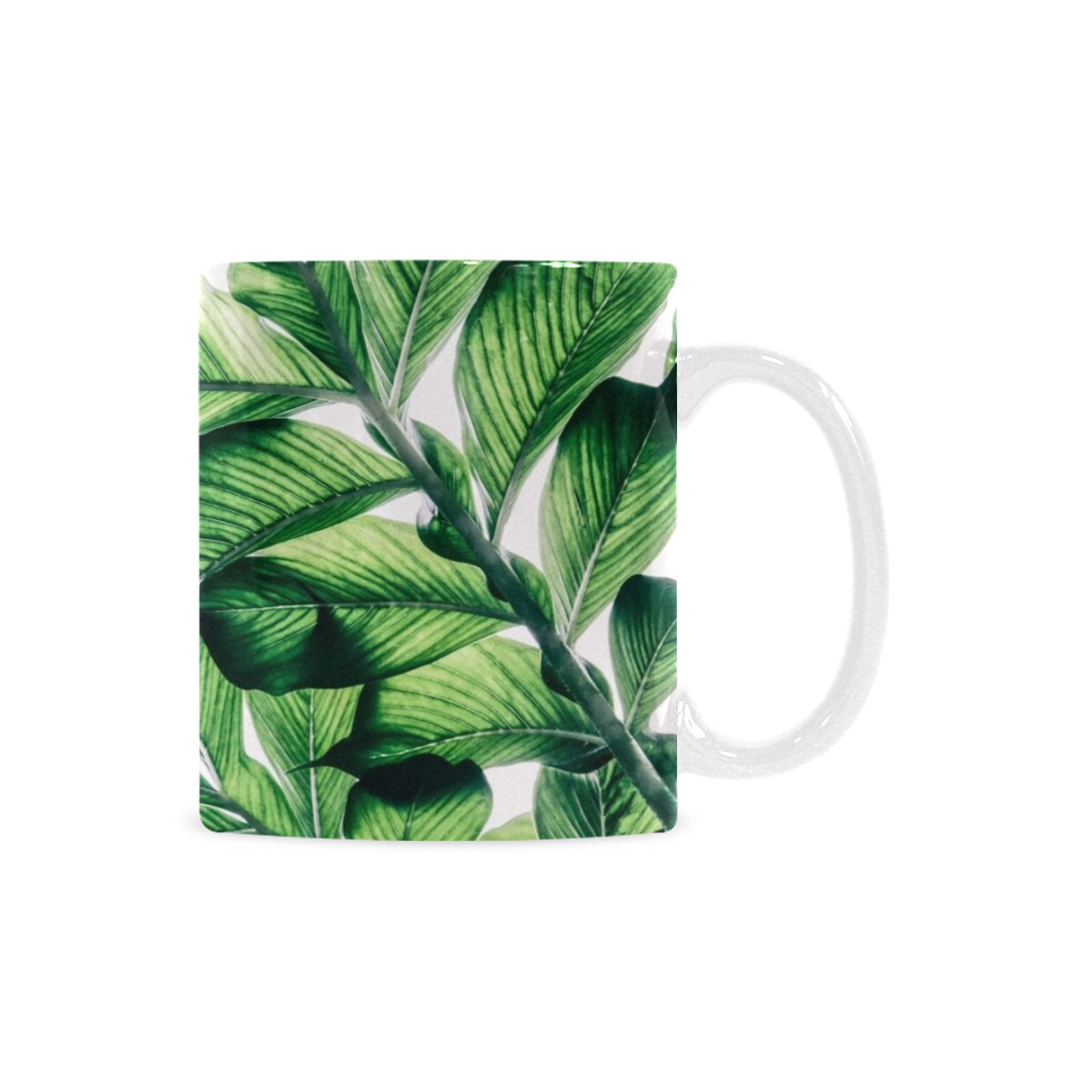 White 11oz ceramic mug with green leaf pattern, USA made for coffee or tea