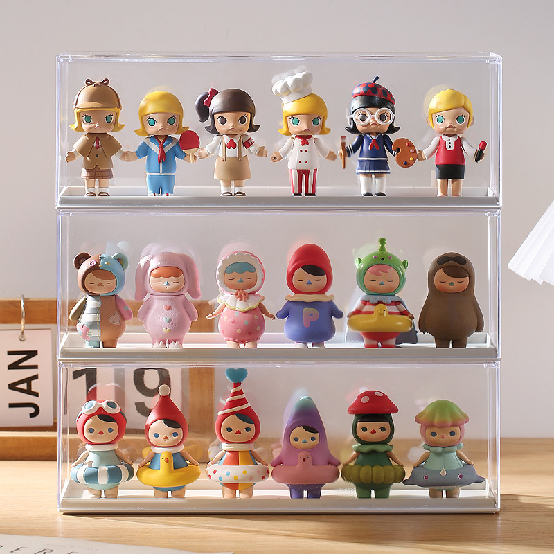 Clear display case with figures sitting in view on a yellow tray