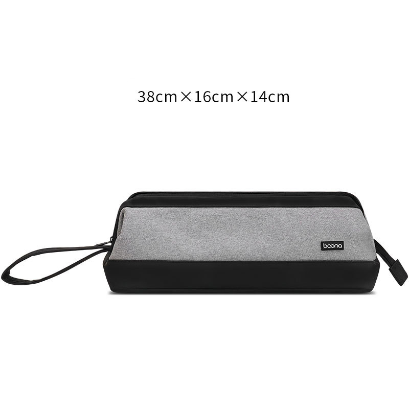 Grey fabric storage bag with black base and wrist strap