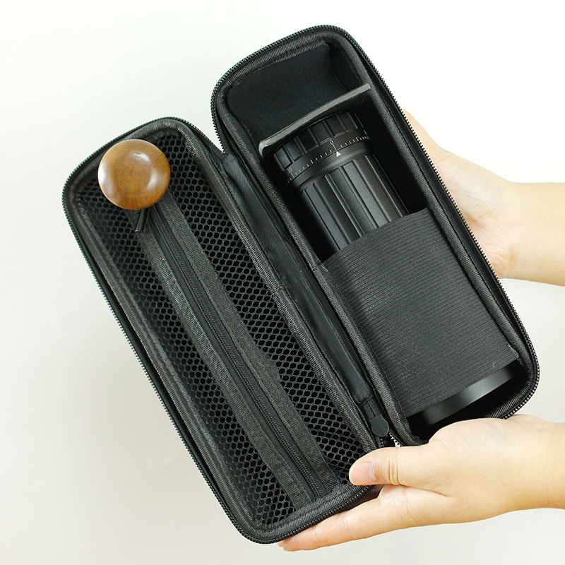 Open black case showing grinder body seated in fitted sleeve