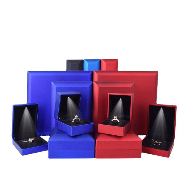 Blue and red LED jewelry boxes of varied sizes with open lids