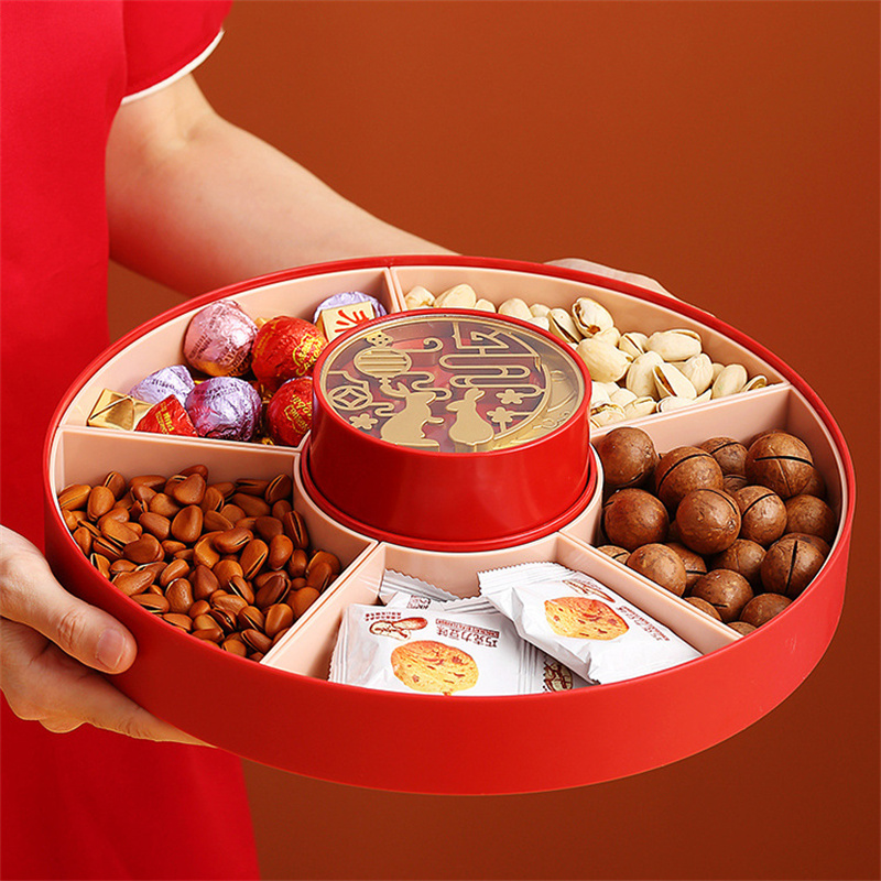 Snacks spilling together on a party table before the tray is set out
