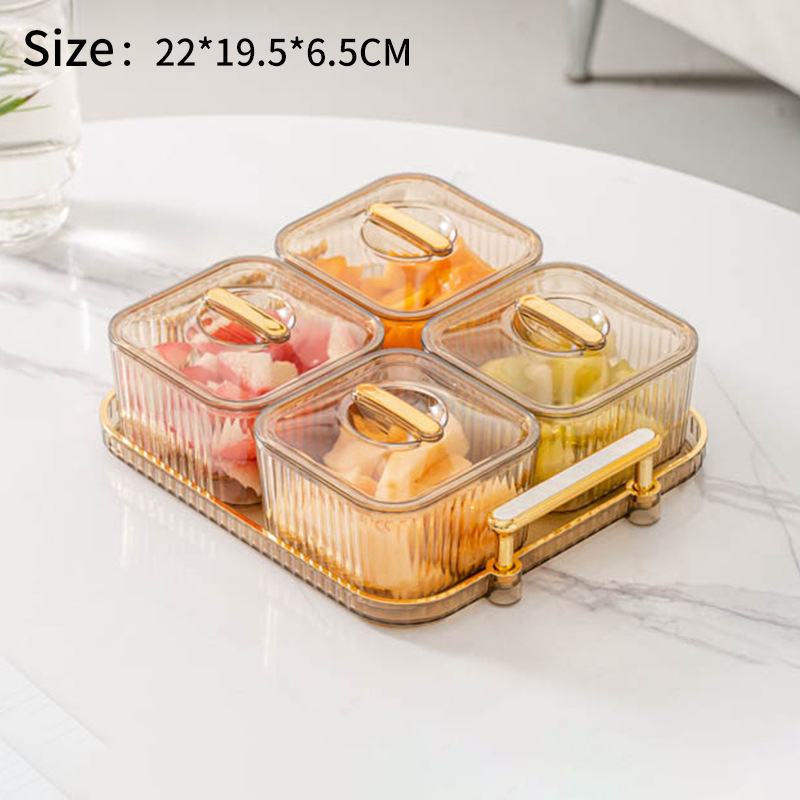 Smoky amber 4-compartment snack tray with gold handle filled with cut fruit