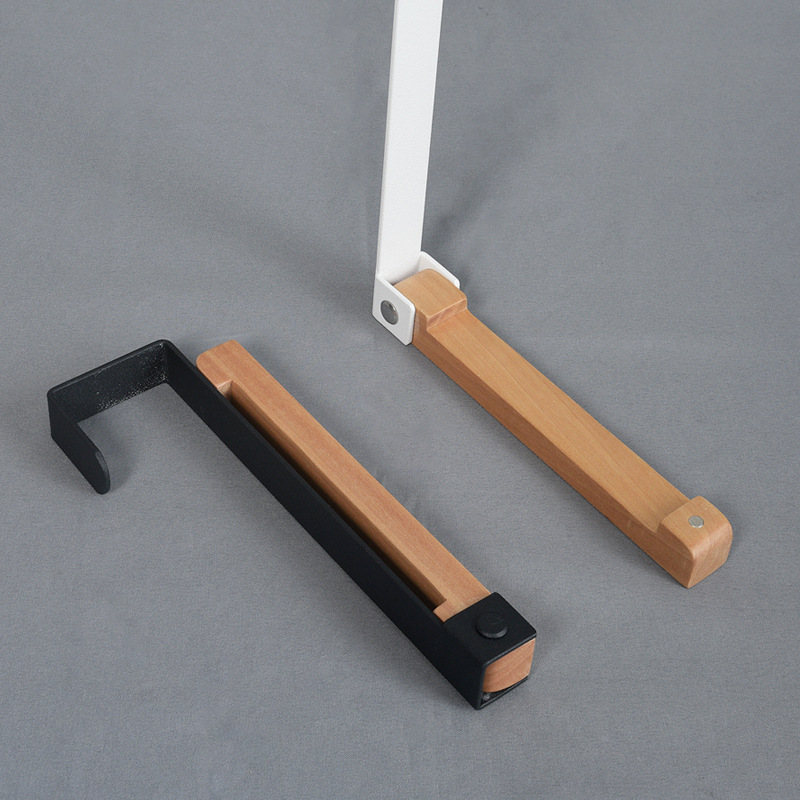Black and white wood door back hooks side by side with metal over-door arms