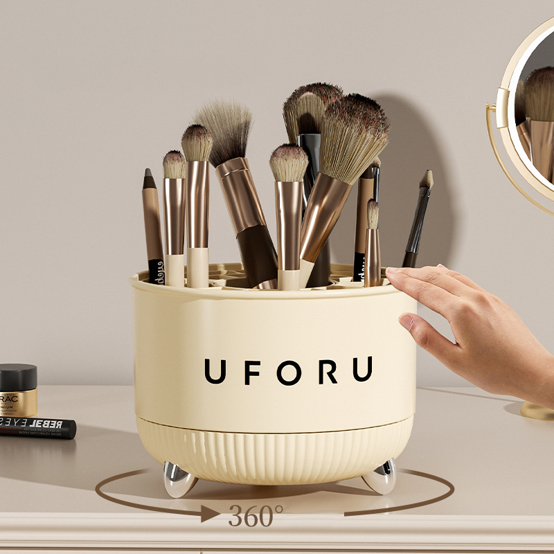 Hand turning the cream rotating brush holder on a styled vanity