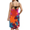 Backless beach dress with spaghetti straps, featuring vibrant abstract print, perfect for seaside outings.