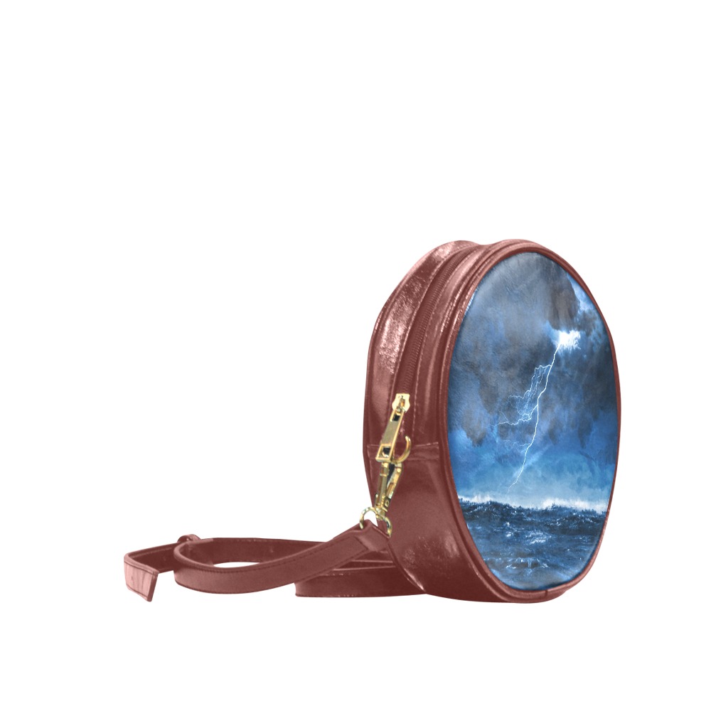 Brown PU leather round messenger bag for women with wave print, adjustable strap, single zip closure. Suitable for shopping.