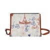 Brown waterproof canvas bag with Eiffel Tower and bicycle print, crossbody design for travel.