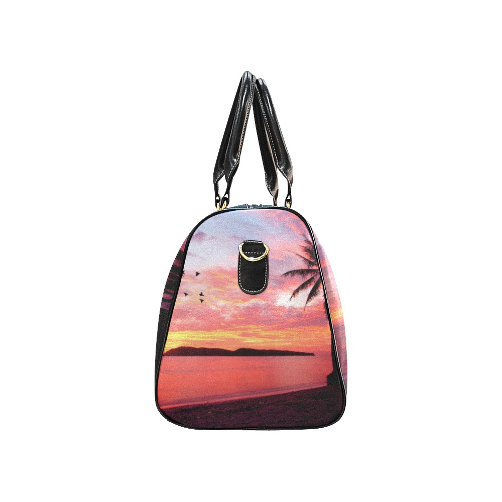 Black travel bag with sunset and palm tree design, waterproof fabric, perfect for travel and outdoor activities.