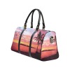 Black travel bag with sunset and palm tree design, waterproof fabric, perfect for travel and outdoor activities.