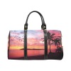 Black travel bag with a sunset and palm tree design, featuring waterproof fabric, ideal for travel and outdoor activities.