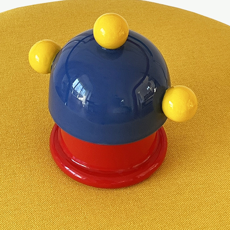 Cobalt dome lid with yellow ball knob on a red base