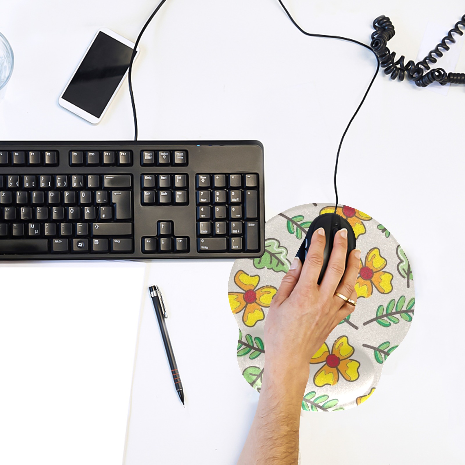 Floral mousepad with wrist support, providing comfortable ergonomic support for long computer use.