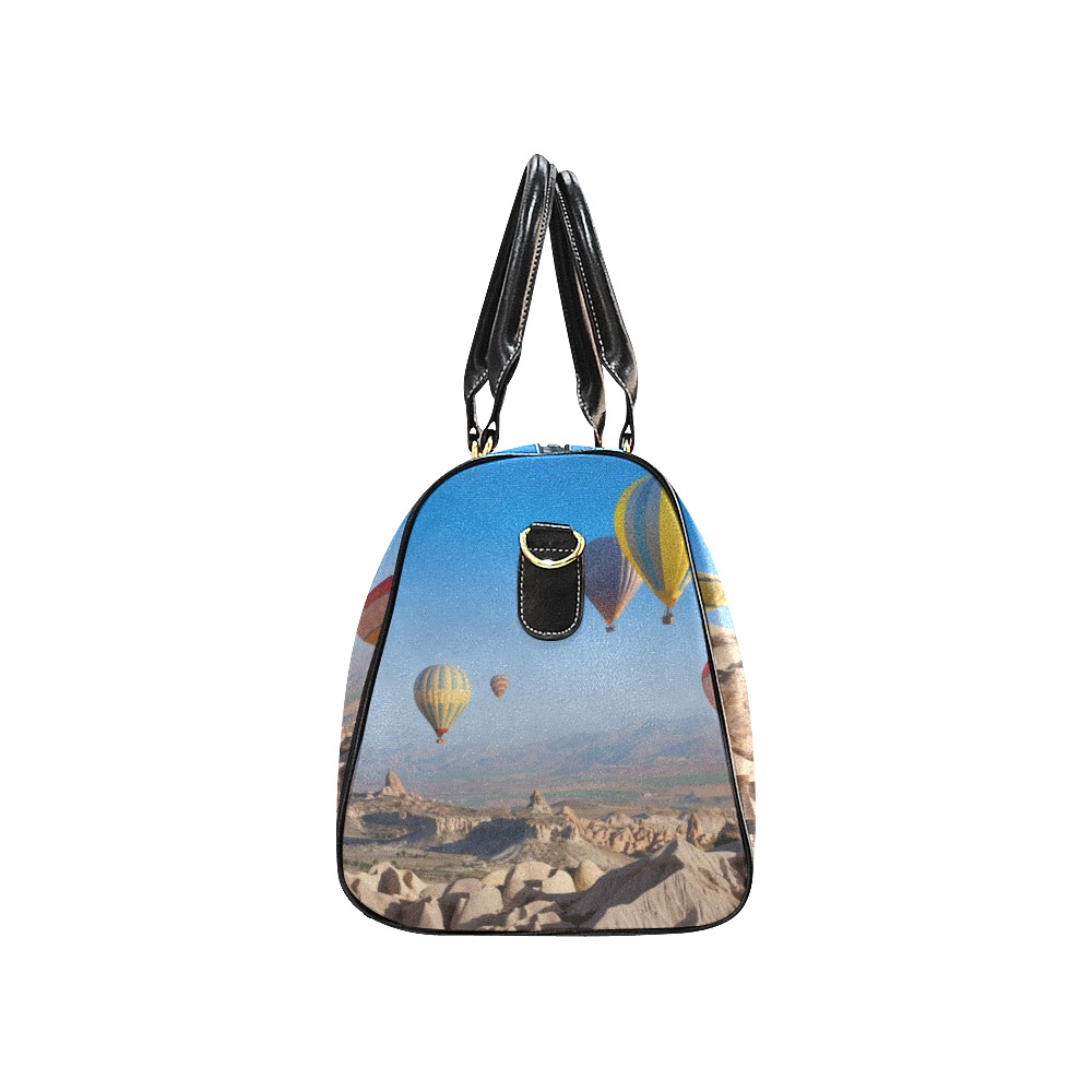 Black travel bag (Model 1639) with hot air balloon design, waterproof and durable, side view.