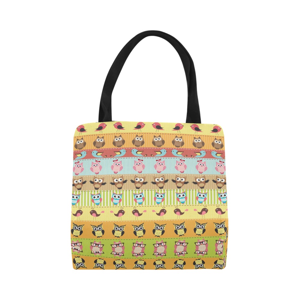 Canvas tote bag with a colorful pattern, featuring black handles, perfect for carrying essentials.