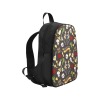Medium canvas backpack with skull and floral pattern, black straps, and padded back, ideal for school or outdoor activities.