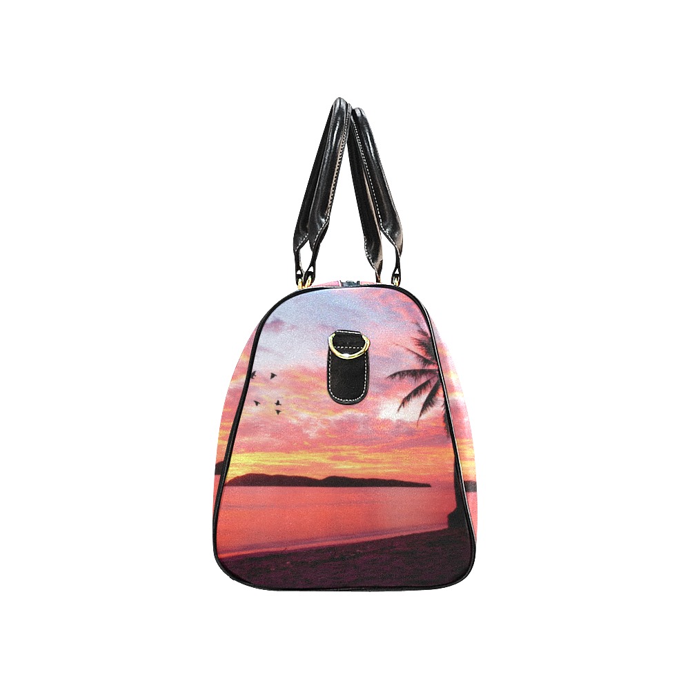 Black travel bag with sunset and palm tree design, waterproof fabric, perfect for travel.