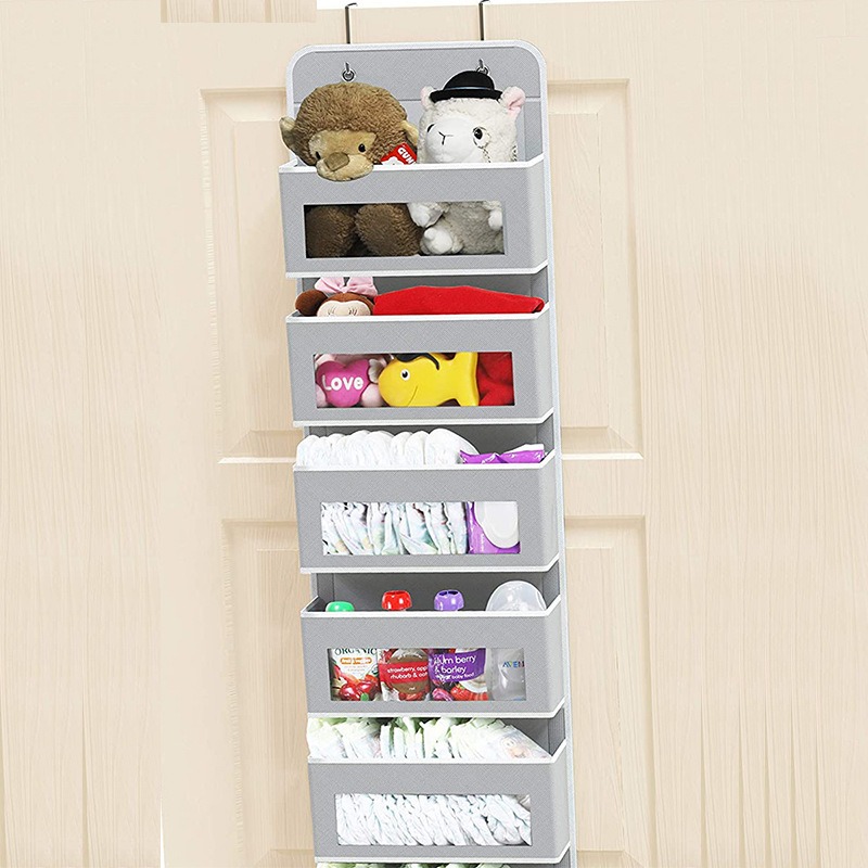 Light gray organizer on a cream door with plush toys and baby supplies visible