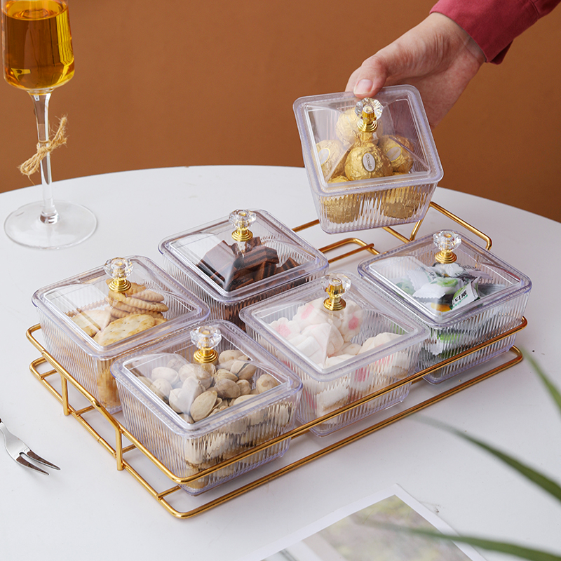 Lidded dish with crystal knob lifted from the rack, filled with chocolates and candies