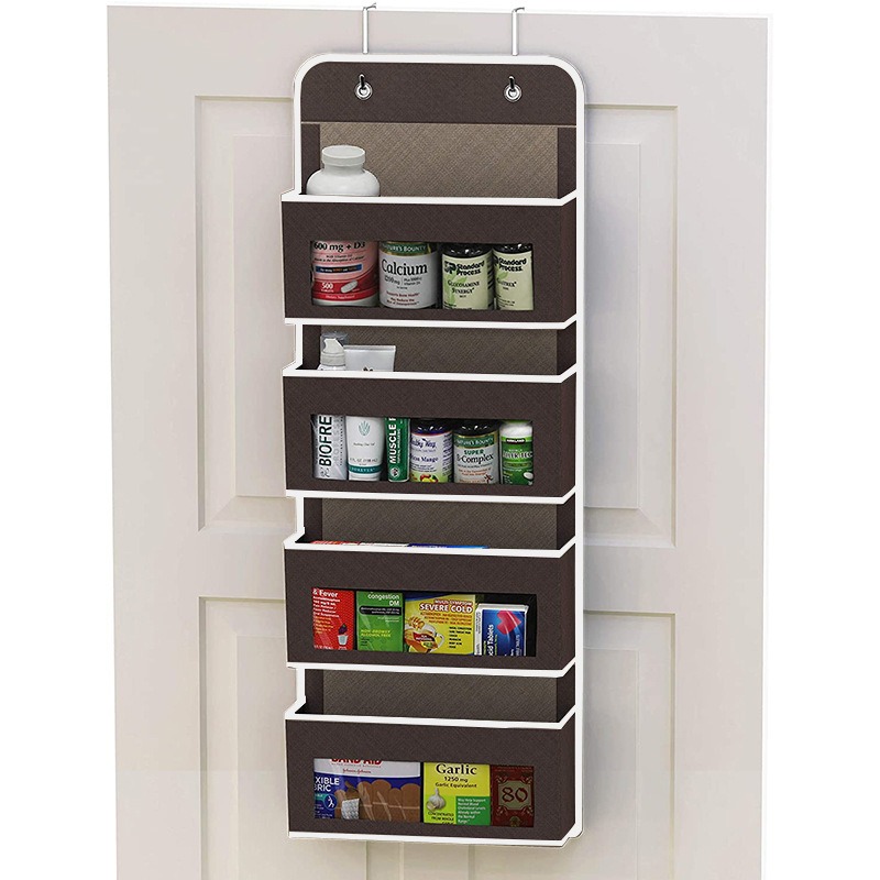Brown over-door organizer holding medicine bottles, vitamins and cold remedies