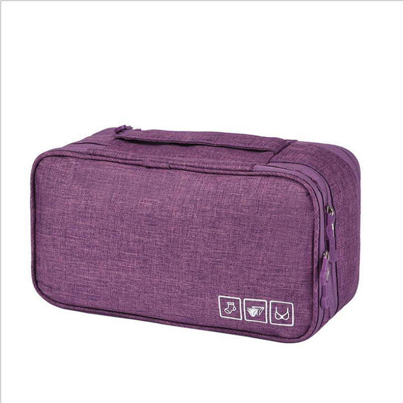 Grey organizer bag with bras and underwear sorted in separate sections