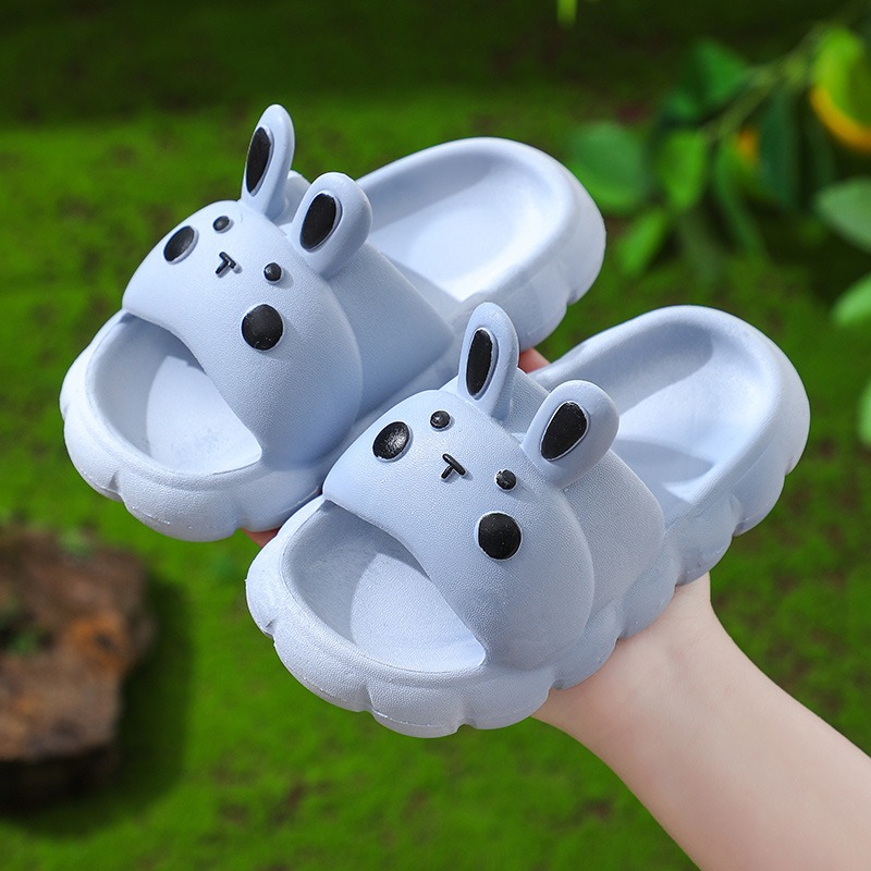 Blue rabbit kids slide held in a hand showing face detail