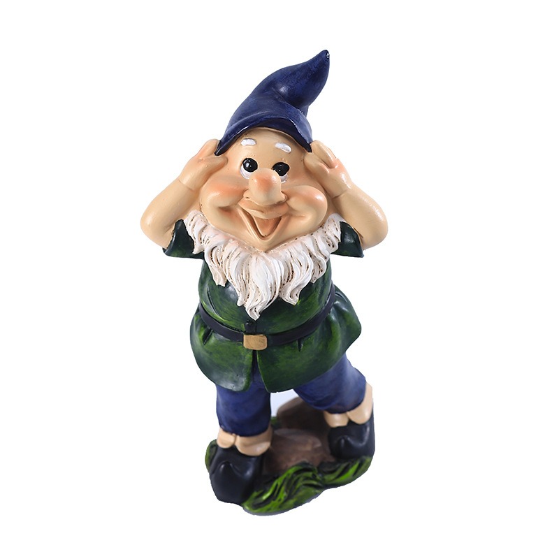 Resin garden gnome with hands over ears on a plain white background