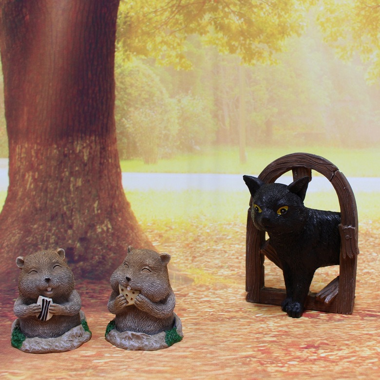 Gopher and cat doorway set photographed together on a light backdrop